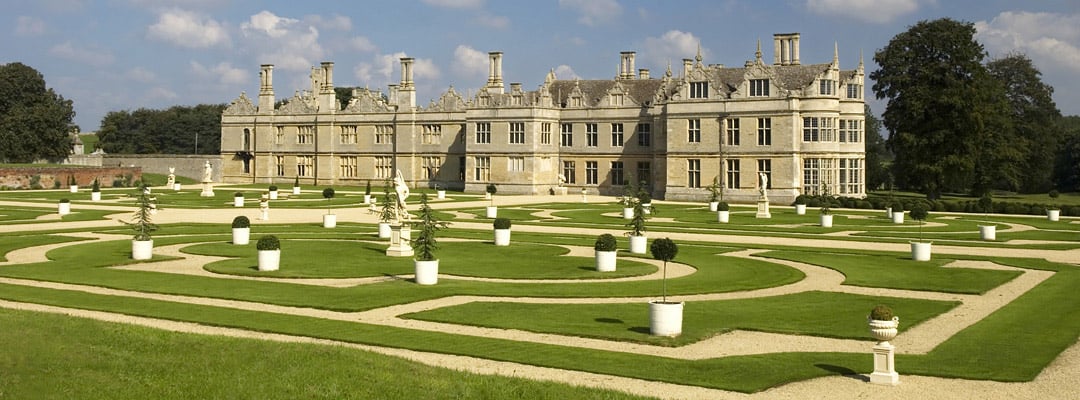 The grand west front of Kirby Hall, Northamptonshire, begun in the 1570s