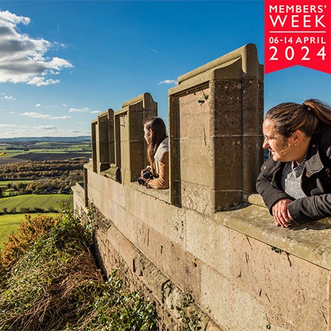 Image: visitors look over the battlements at Bolsover Castle