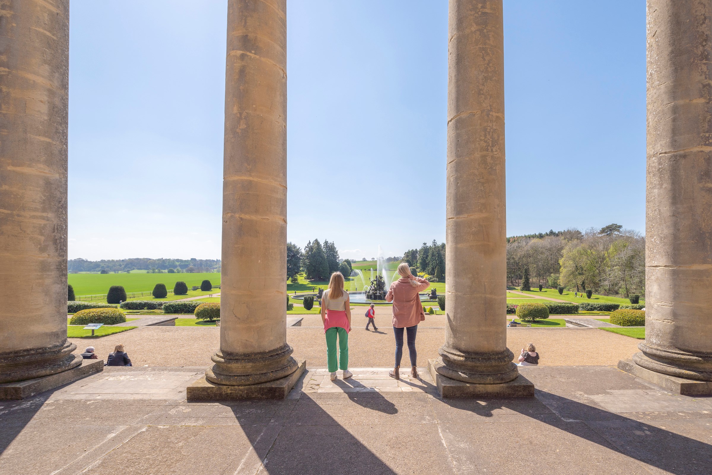 Image: A parent and child look out over the gardens at Witley Court