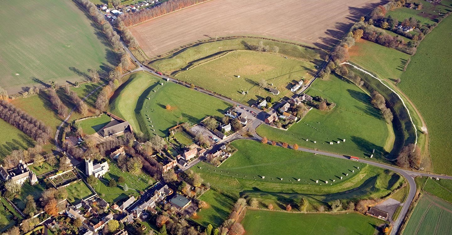 Aerial view of Avebury showing the stone circle, church and neighbouring Alexander Keiller Museum