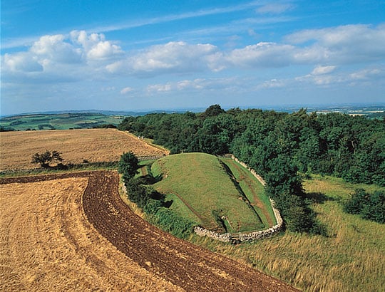 Aerial view of Belas Knap Long Barrow looking towards the entrance