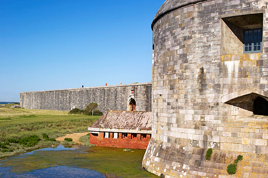 The Tudor Hurst Castle from the west with brick-built caponier projecting at ground level The Tudor Hurst Castle from the west with brick-built caponier projecting at ground level