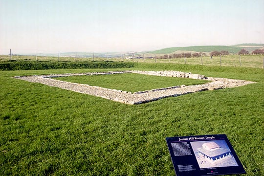 The foundations of the temple with an English Heritage inofrmation board in the foreground