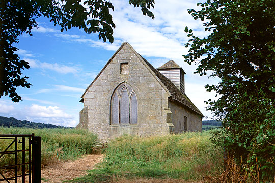 Langley Chapel, viewed from the east through a field gate