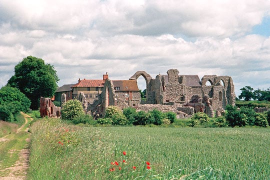 View of the abbey from the south, across a field edged with poppies