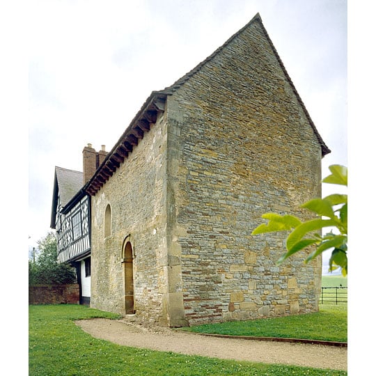 The stone Anglo-Saxon chapel attached to a timber-framed house