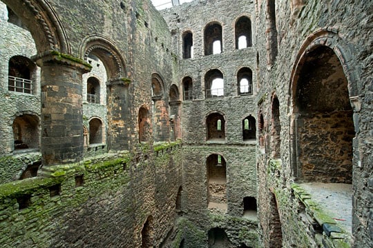 The interior of Rochester Castle, showing the chevron decoration (left) on the arches of the arcade at second-floor level
