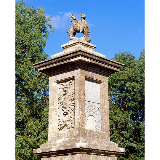 Sir Bevil Grenville's Monument, the tall plinth mounted by a griffin standing against a deep blue sky