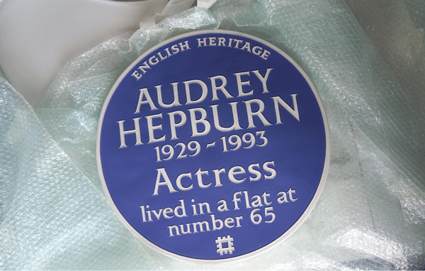 A blue plaque reads: Audrey Hepburn 1929-1993 Actress lived in a flat at number 65 A blue plaque reads: Audrey Hepburn 1929-1993 Actress lived in a flat at number 65