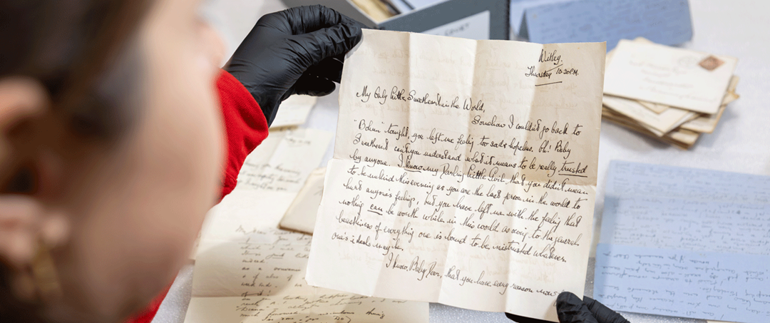 Image: A curator examines the love letters Image: A curator examines the love letters