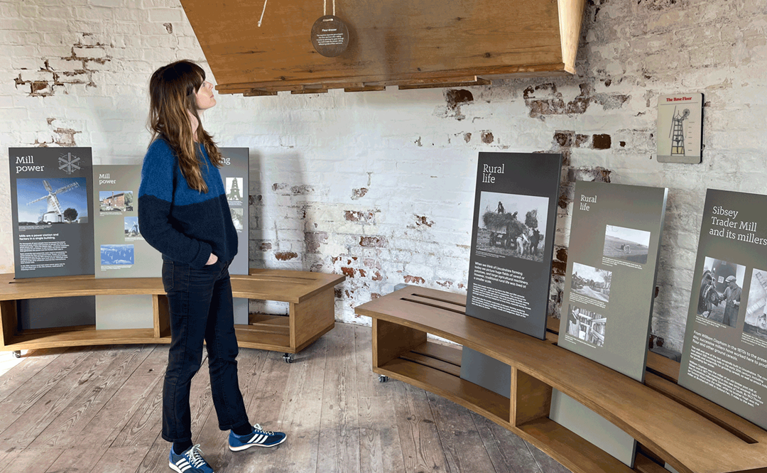 Image: a visitor enjoys the new interpretation inside Sibsey Trader Mill Image: a visitor enjoys the new interpretation inside Sibsey Trader Mill