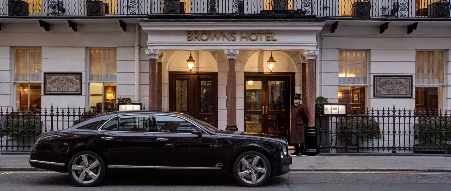 The entrance to Brown's Hotel in London, with a black car parked on the road in the foreground.