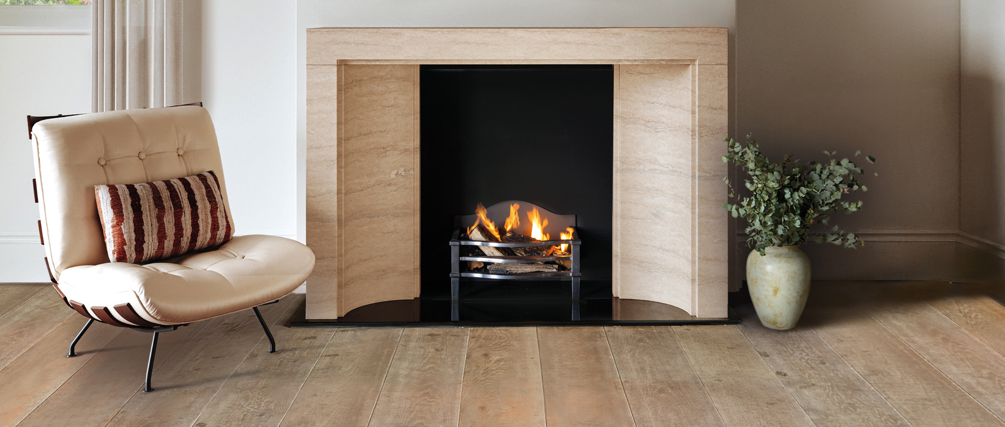 An image of the Eltham Fireplace by Chesneys in a country house background.