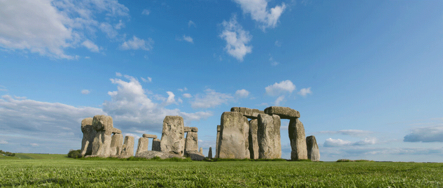 Stonehenge underneath a blue sky.