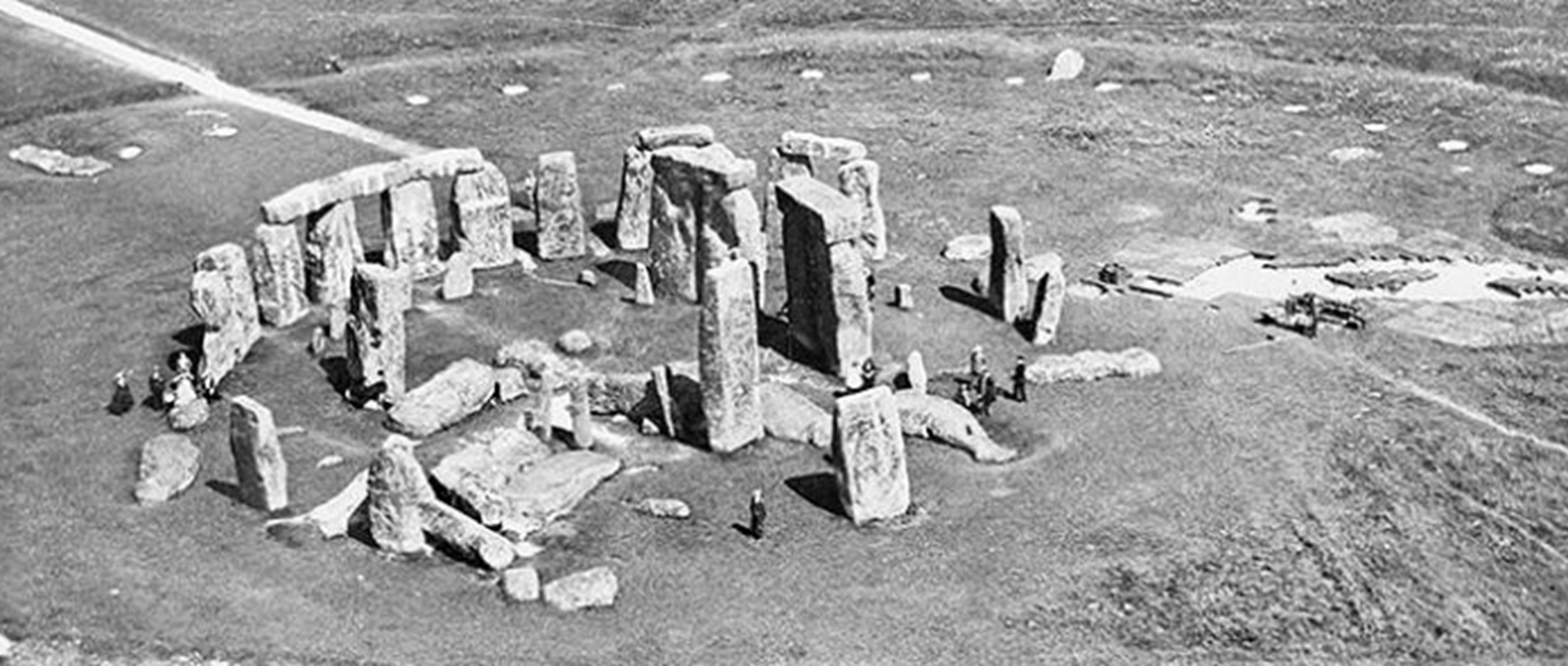 Aerial photograph of Stonehenge taken on 10 July 1924. The restoration work has ended, but Colonel Hawley’s excavations are continuing on the south-east side of the monument. 