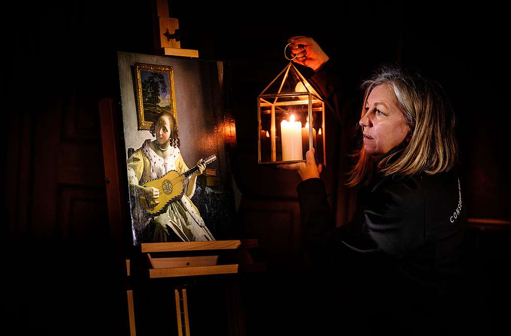 Conservators view Vermeer’s ‘Guitar Player’ by candlelight