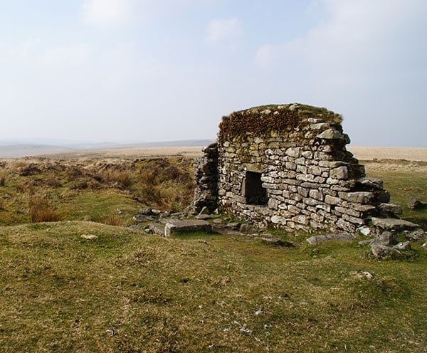 The remaining wall of one of the mine buildings at Eylesbarrow mine
