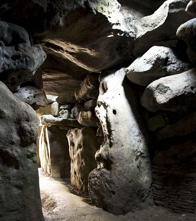 The stone interior of West Kennet Long Barrow in Avebury, Wiltshire