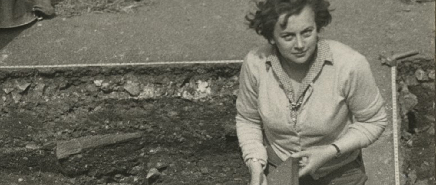 Black and white photography of Rosemary Cramp at an archaeological dig
