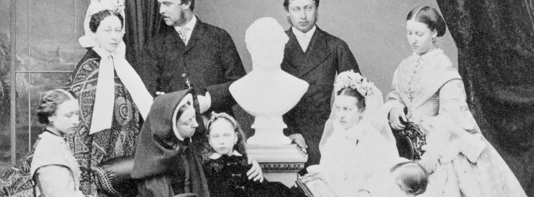 Queen Victoria and family in 1863, grouped around a bust of Prince Albert, who died two years earlier