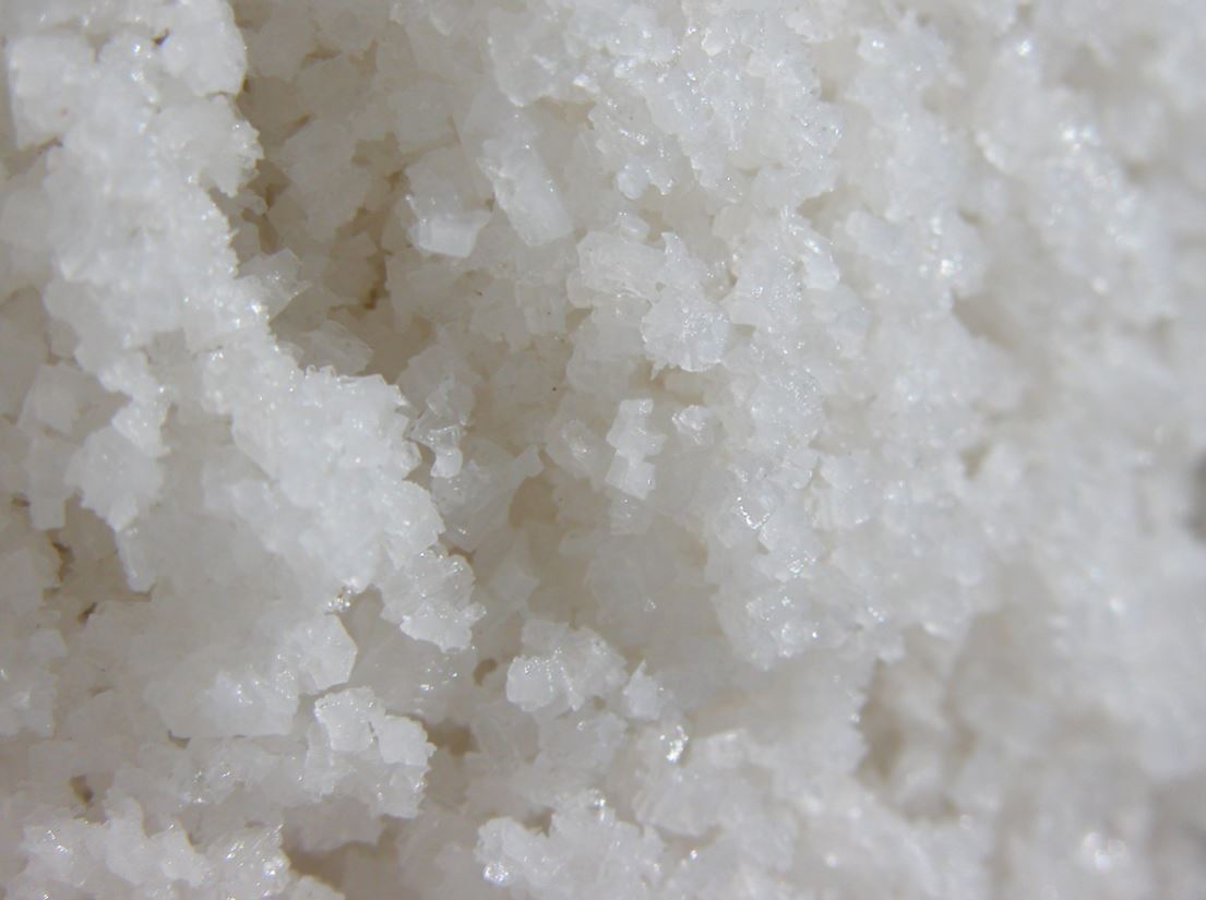 An image of white salt crystals which fill the frame.