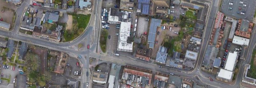 An aerial view of Dartford Spital Street, showing roads, buildings and small green spaces. 