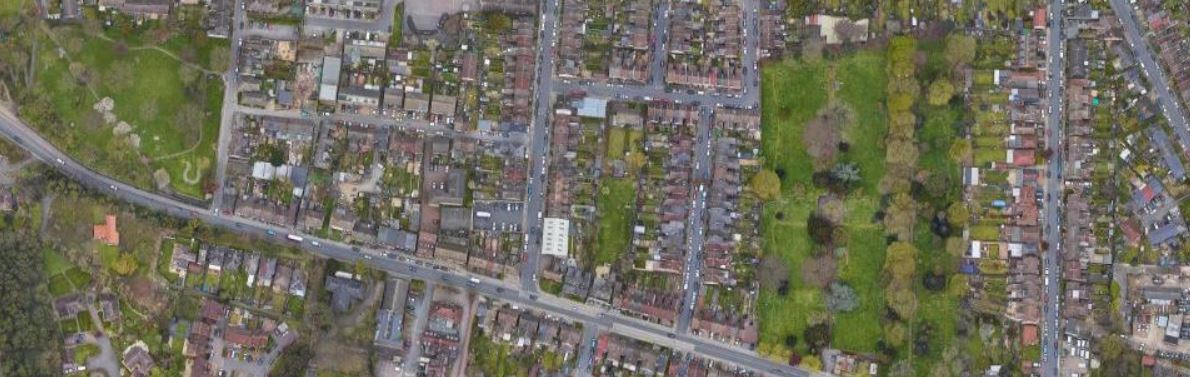 An aerial view of East Hill, Dartford. This shows a modern built up area with small areas of green space, including a cemetery.