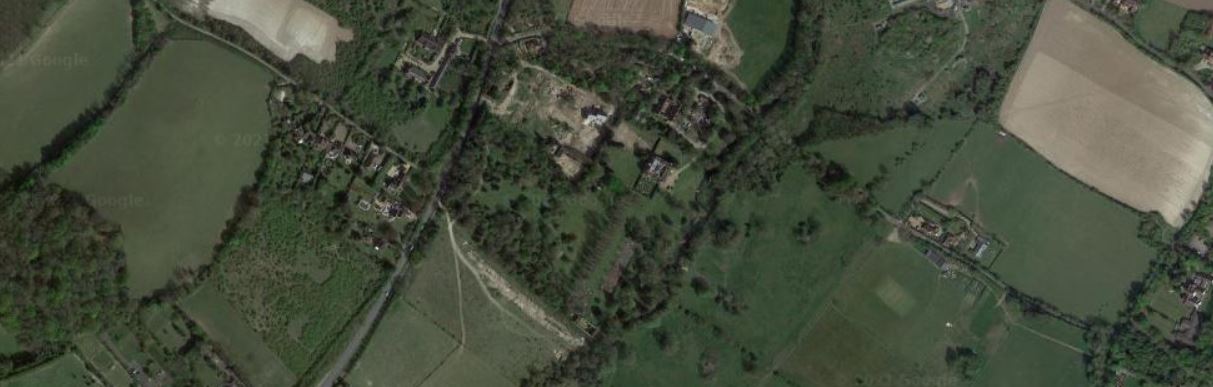 An aerial photograph showing a birds-eye view of fields and trees around the Franks Hall Villa site.