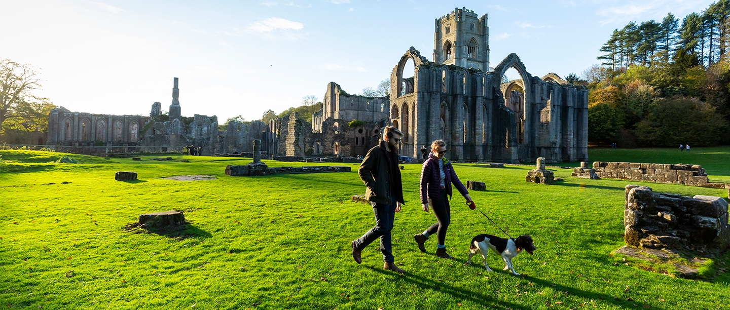 Image: visitors explore Fountains Abbey