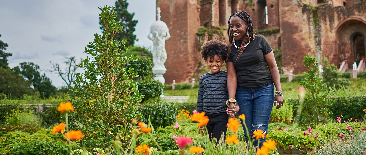 Image: mother and son enjoy the Elizabethan Garden at Kenilworth Castle