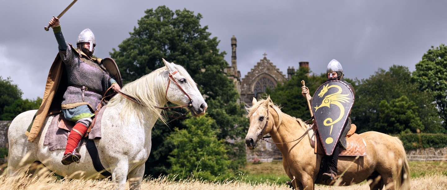 Image: Alan Larsen and Laura Finch, equine consultant and Norman cavalry re-enactor at 1066 Battle of Hastings, Abbey and Battlefield