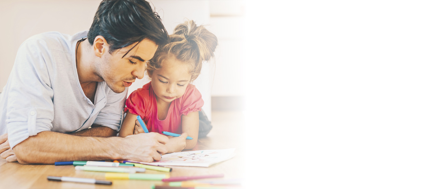 Image: Young girl doing colouring in with an adult