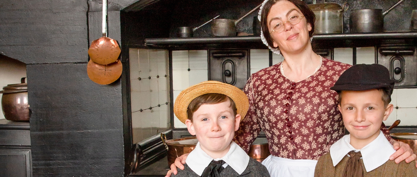 Mrs Crocombe and two young English Heritage members in Victorian period dress