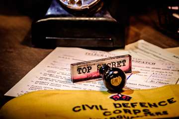 Image: top secret stamp with telegram and Civil Defence Corps arm band