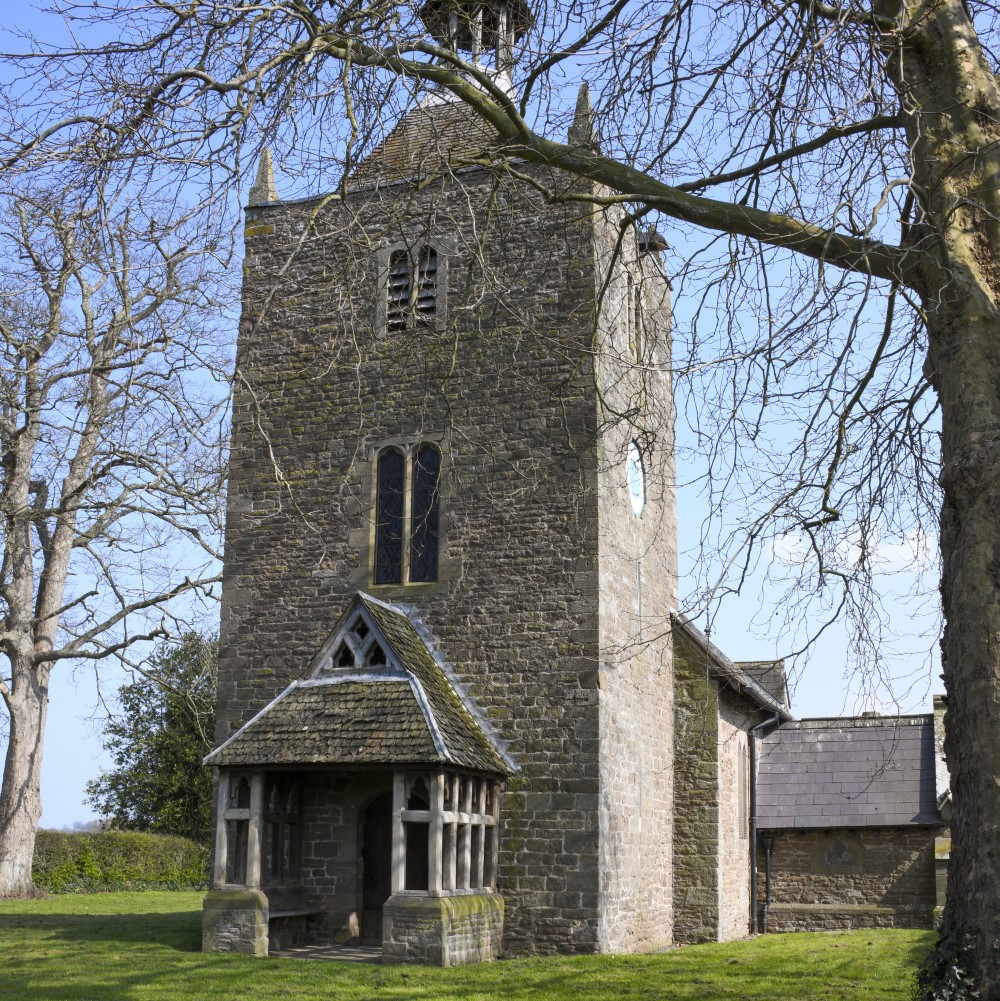 Photo of the front of Rotherwas Chapel on a sunny day