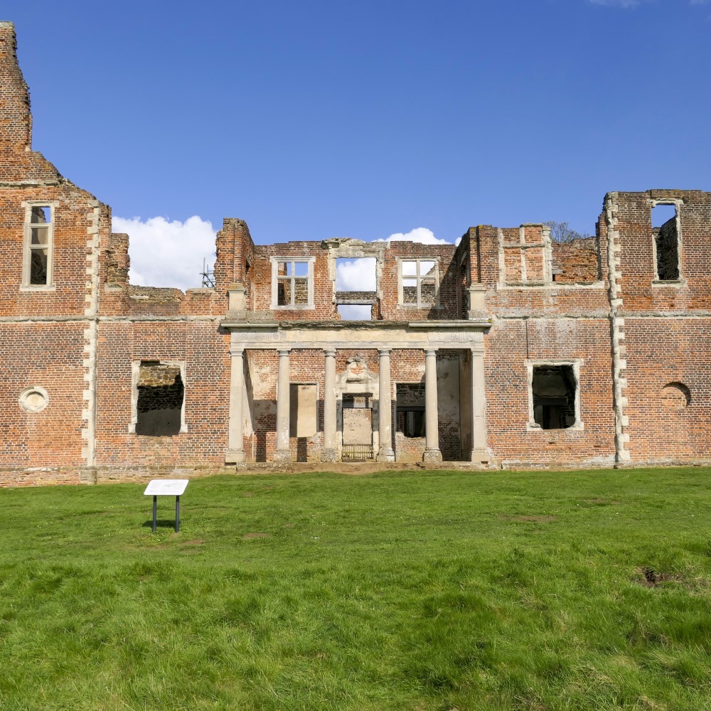 Photo of the brick remains of Houghton House on a sunny day