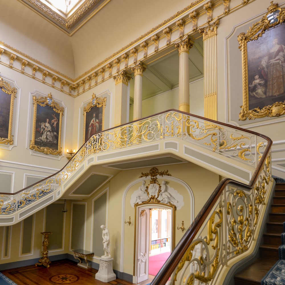 Photo of ornate portraits and a staircase at Wrest Park
