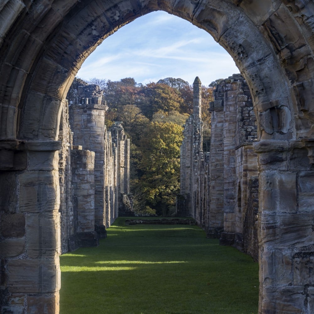Photo looking through an archway in the remains of Finchale Priory