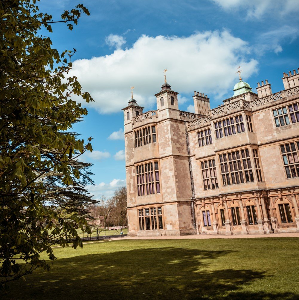 Photo of the exterior and grounds of Audley End House on a sunny day