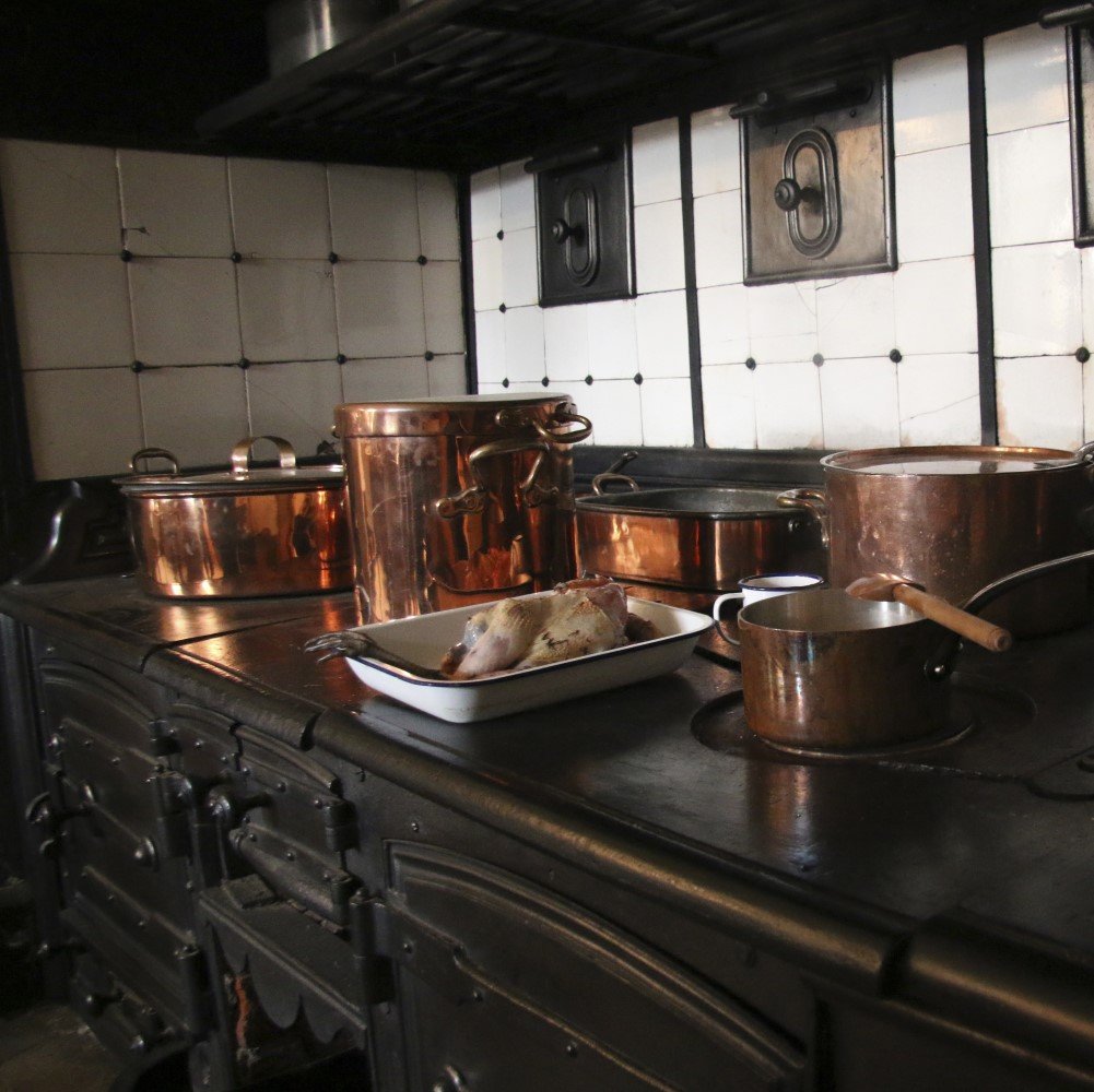 Photo of ovens and pans in the Victorian kitchen at Audley End House and Gardens