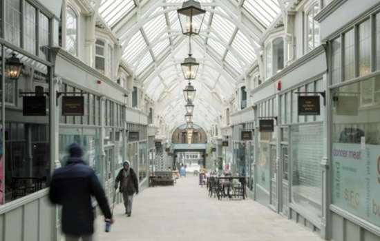 Photo of a glass-roofed shopping arcade in Leeds