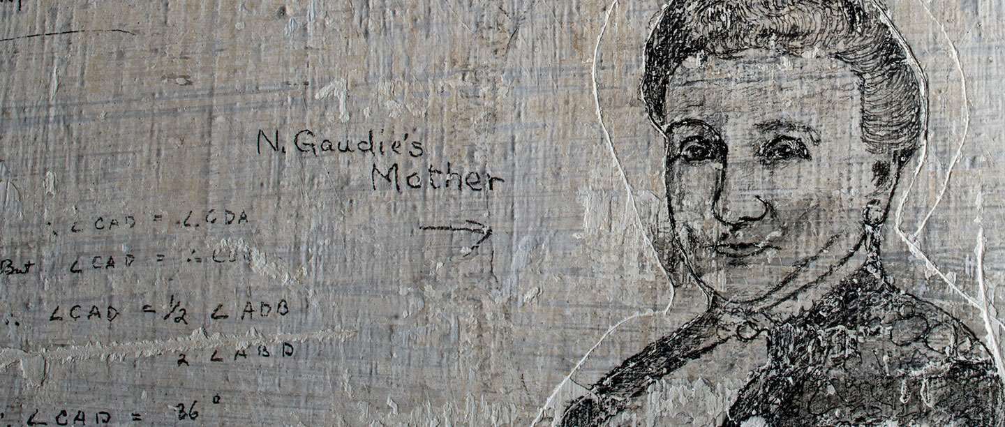 Detail of graffiti portrait of woman etched onto limewashed wall