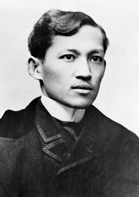Black and white head and shoulders portrait photograph of José Rizal, a clean-shaven man with short dark hair and a white collar Black and white head and shoulders portrait photograph of José Rizal, a clean-shaven man with short dark hair and a white collar