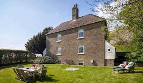 Private garden with outdoor seating and dining Private garden with outdoor seating and dining