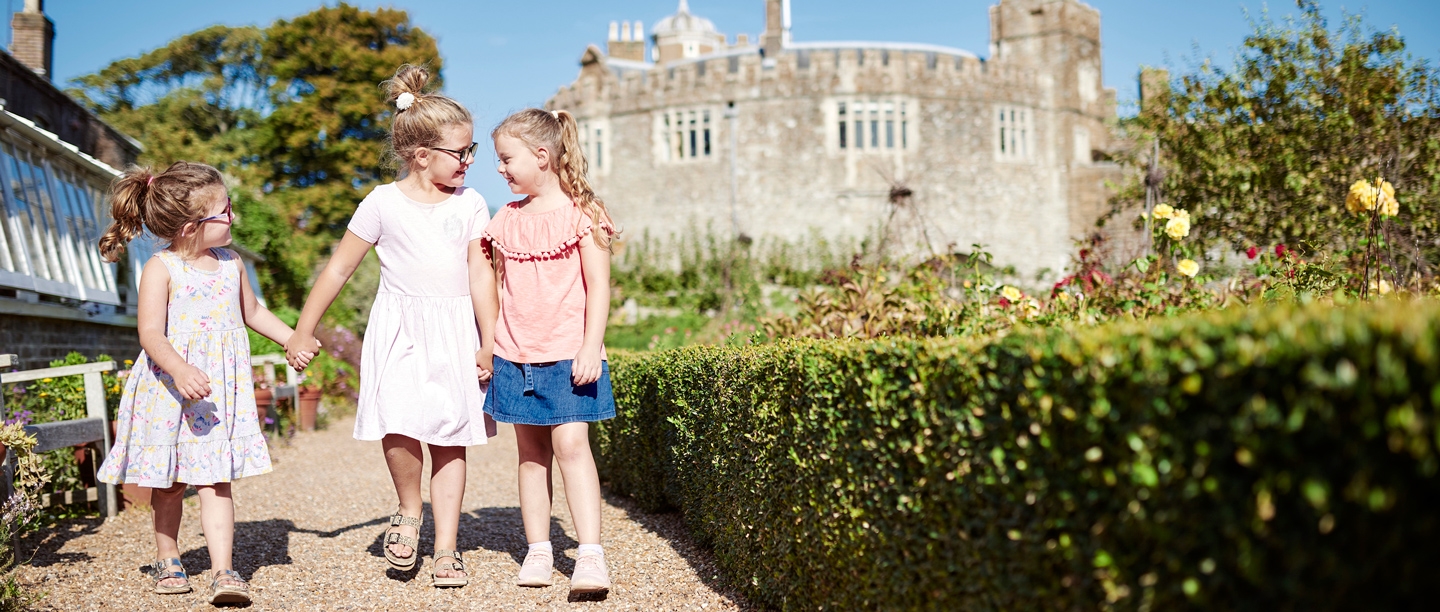 Image: three young visitors at Walmer Castle and Gardens