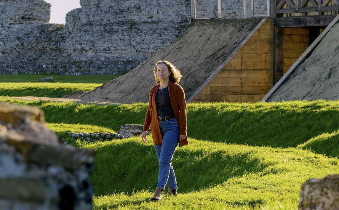 Image: A person walking around the amphitheatre at Richborough Roman Fort