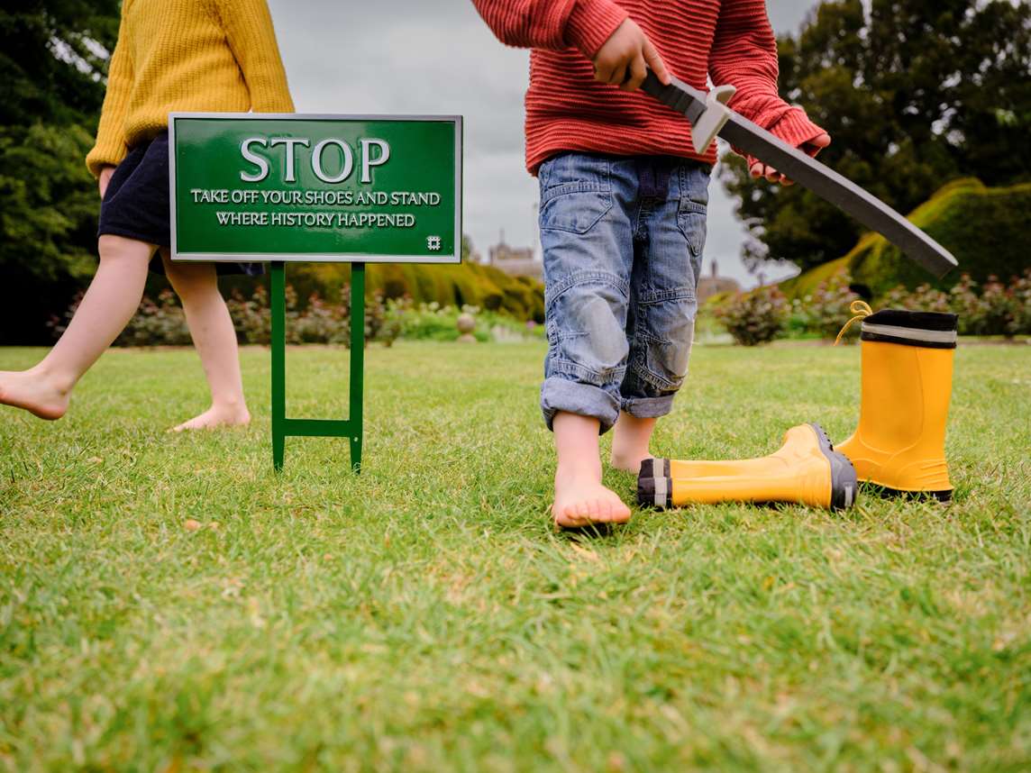 Image: Two children walking barefoot on the grass Image: Two children walking barefoot on the grass
