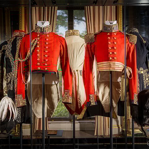 Fine Napoleonic military uniforms on display stands