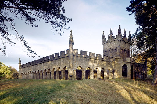 Auckland Castle Deer House on raised ground amongst mature trees