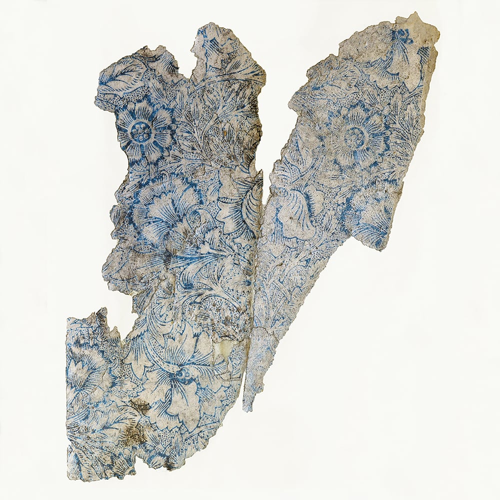 Fragments of wallpaper shown after conservation and reassembly.